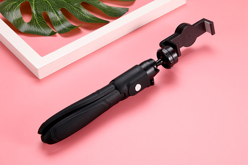 Selfie stick tripod folded into handle